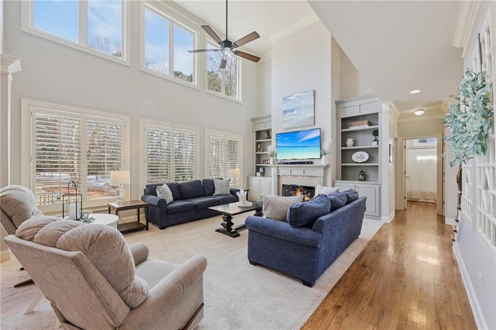 5775 Cascade Trail Cumming, GA 30040 - Photo 7 of 49 a living room with furniture and a large window