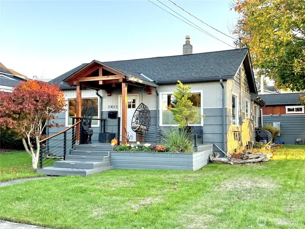 a front view of a house with garden