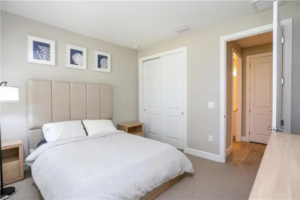 a bedroom with a bed and a view of bedroom