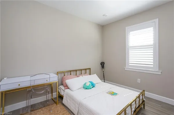 a bedroom with a bed and a table