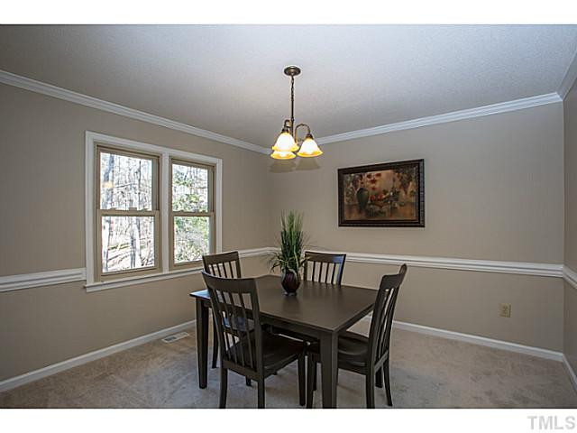 6 Hitching Rack Court Durham, NC 27713 - Photo 6 of 10 UPDATED lighting, NEW carpet, and FRESH paint grace the dining room which flows nicely from kitchen and into living room. Dining Room