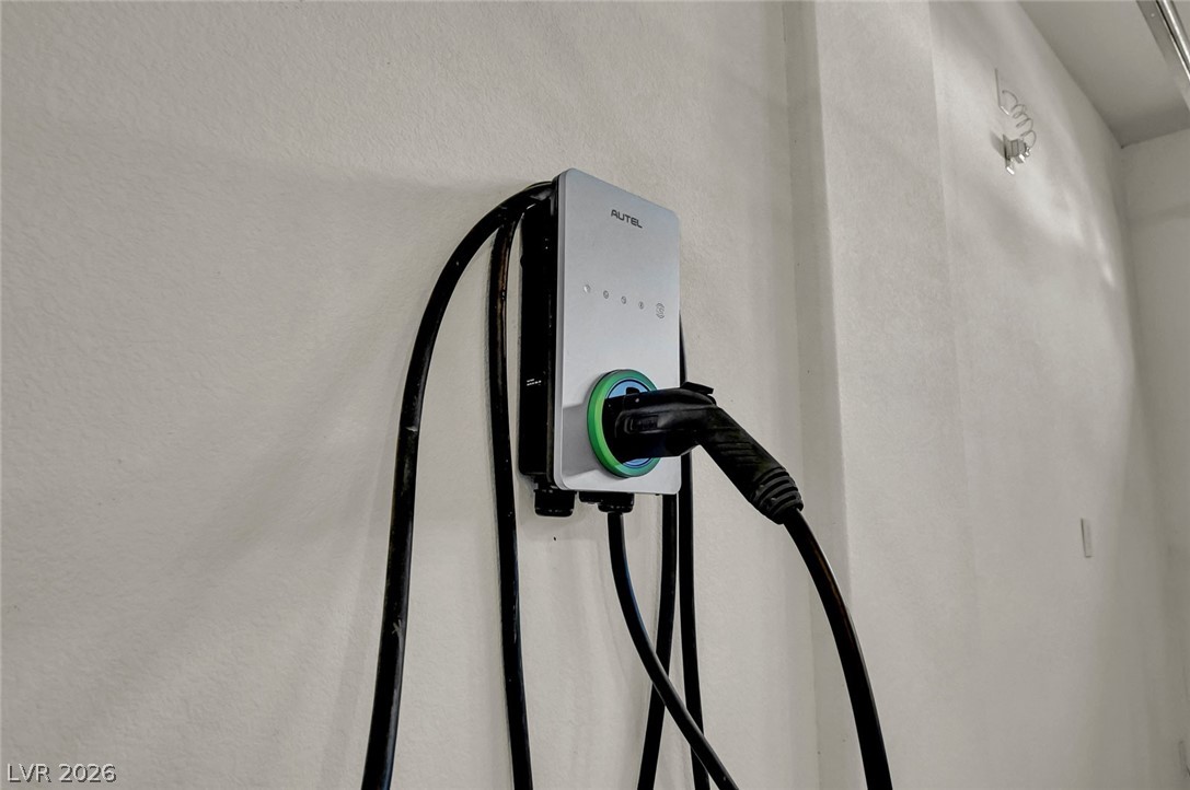 977 Sparkling Light Street Henderson, NV 89052 - Photo 64 of 75 This modern charging station provides convenient electric vehicle power within your home's garage.