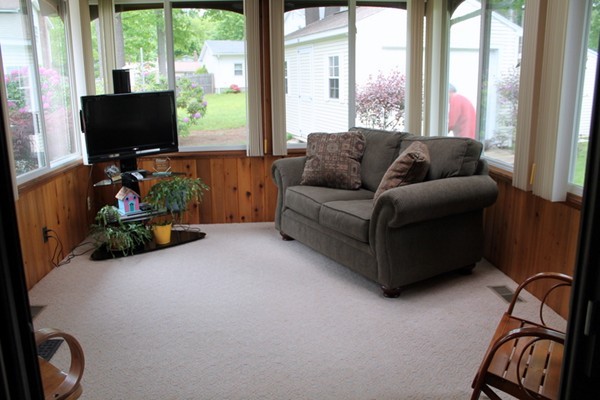 89 Calley Street Springfield, MA 01129 - Photo 8 of 30 a living room with furniture and a flat screen tv