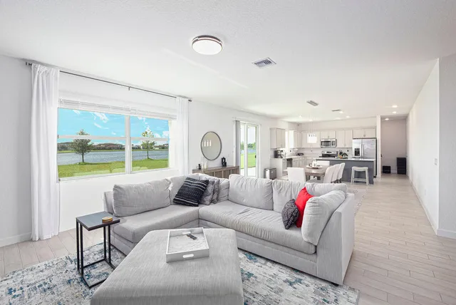 a bedroom with a bed and a couch