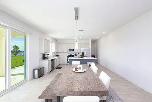 a bathroom with a sink a tub and a mirror