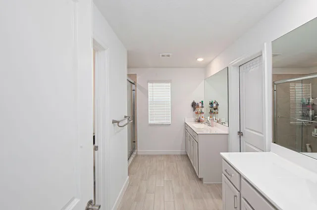 a bathroom with a shower and a shower