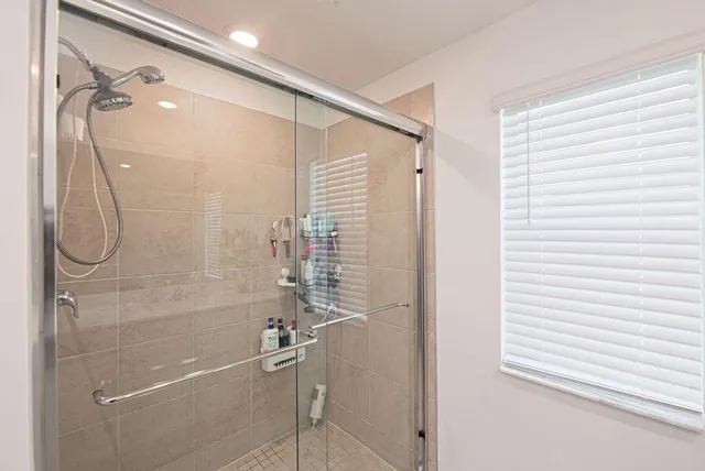 an aerial view of a house with a swimming pool