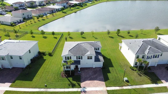 an aerial view of a house with a garden and swimming pool