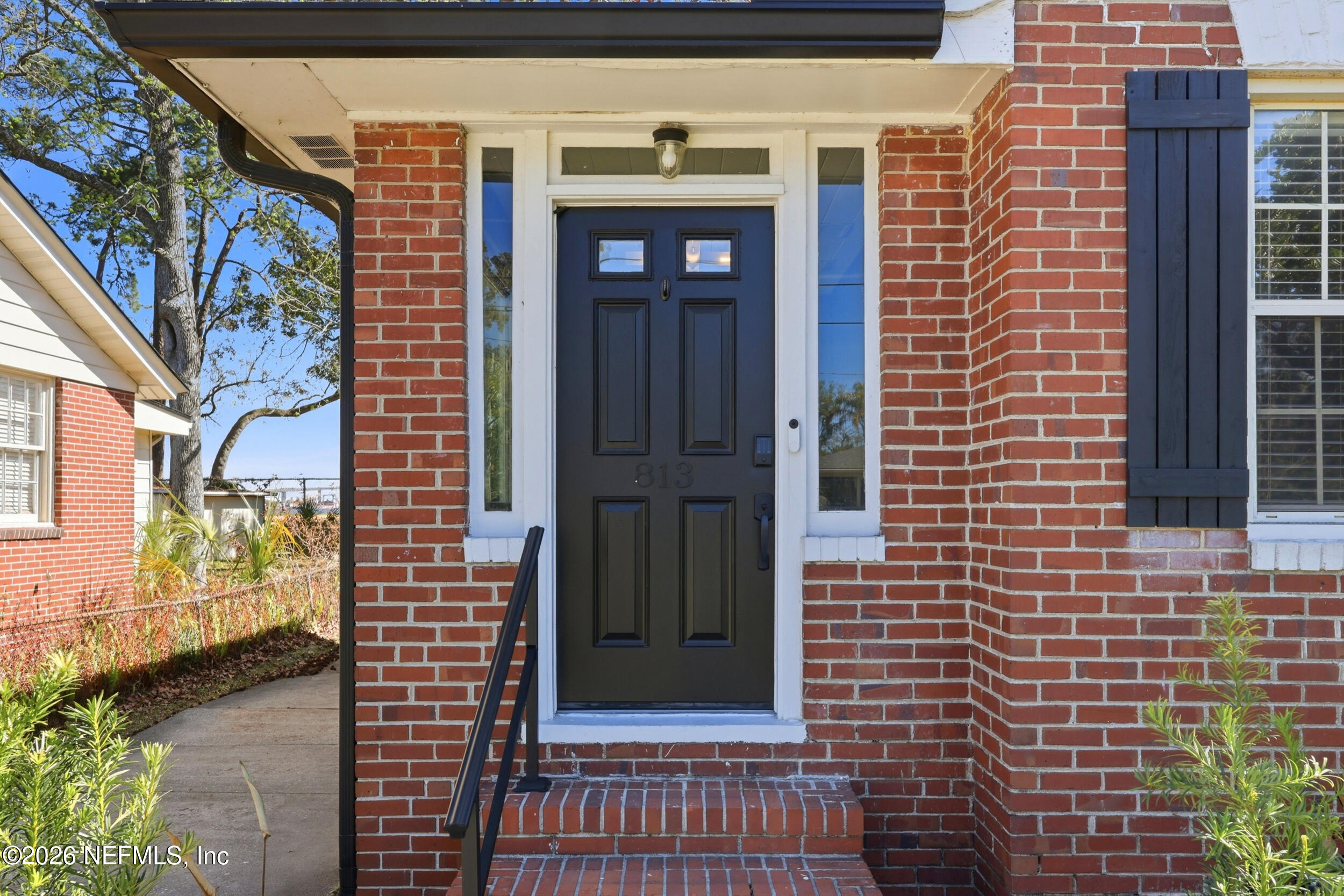 813 Old Hickory Road Jacksonville, FL 32207 - Photo 2 of 28 a front view of a building with a door and a window