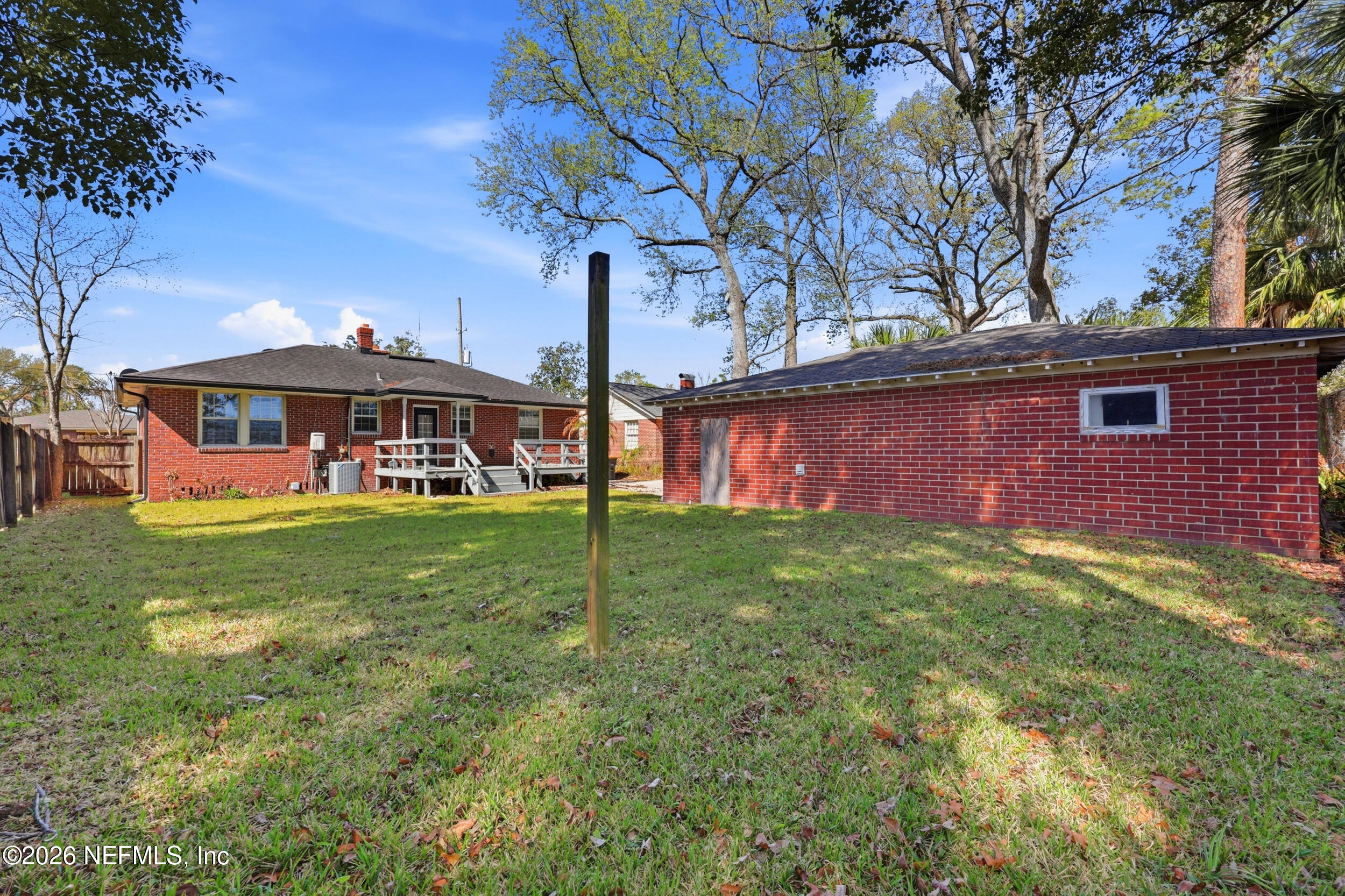 813 Old Hickory Road Jacksonville, FL 32207 - Photo 27 of 28 a view of an house with backyard and a tree