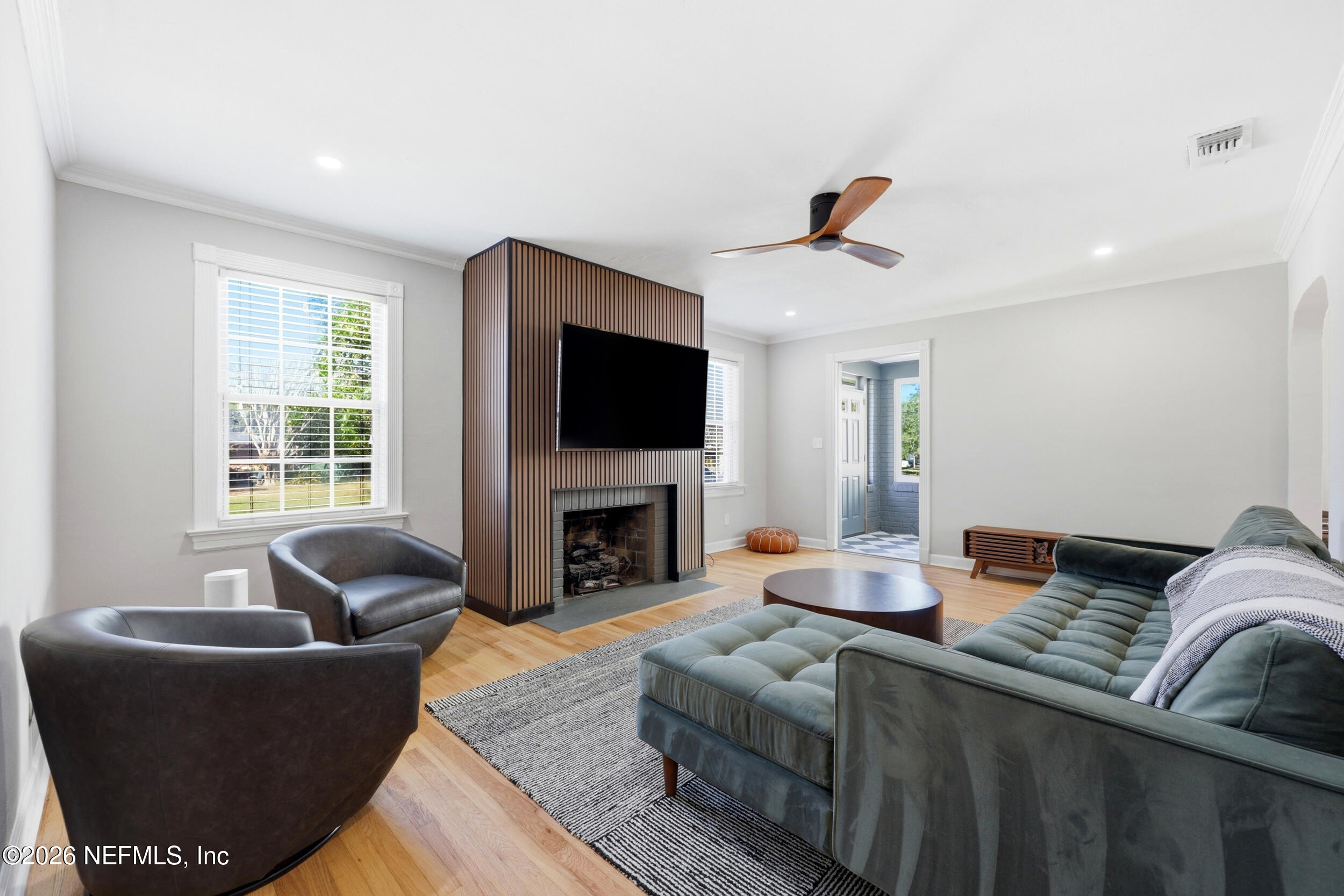 813 Old Hickory Road Jacksonville, FL 32207 - Photo 6 of 28 a living room with furniture a flat screen tv and a fireplace