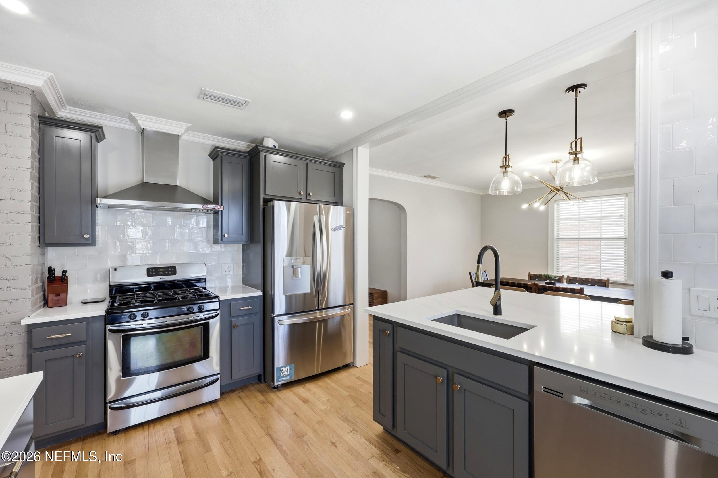 813 Old Hickory Road Jacksonville, FL 32207 - Photo 8 of 28 a kitchen with a sink stainless steel appliances and cabinets