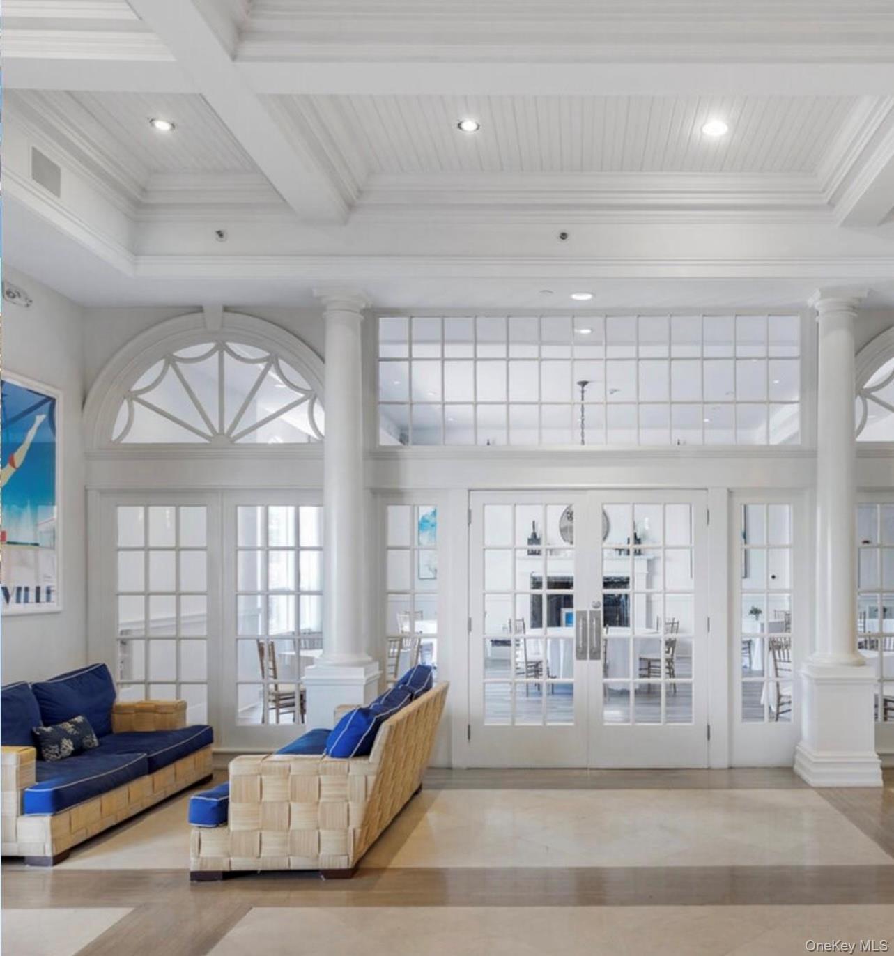 231 Dune Road, Unit 905 Westhampton Beach, NY 11978 - Photo 12 of 24 Lobby with beamed ceiling, ornamental molding, and recessed lighting