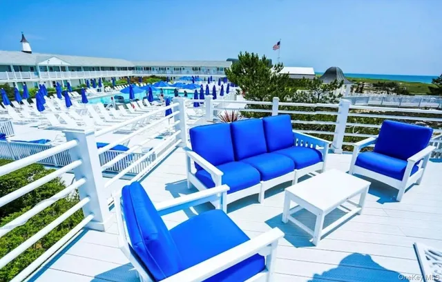 a view of a chairs and table in patio