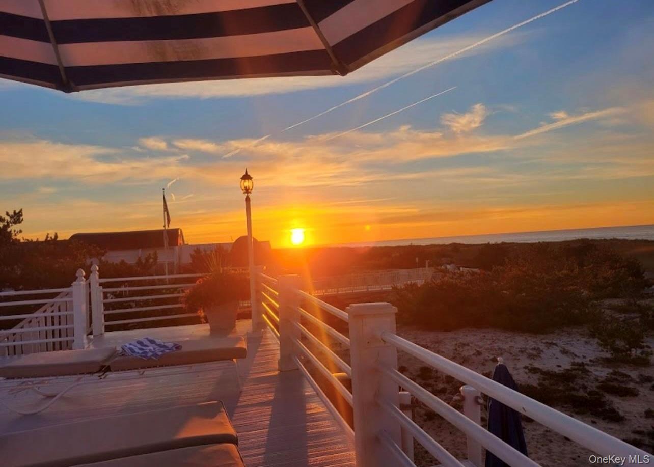 231 Dune Road, Unit 905 Westhampton Beach, NY 11978 - Photo 23 of 24 Sunset on deck