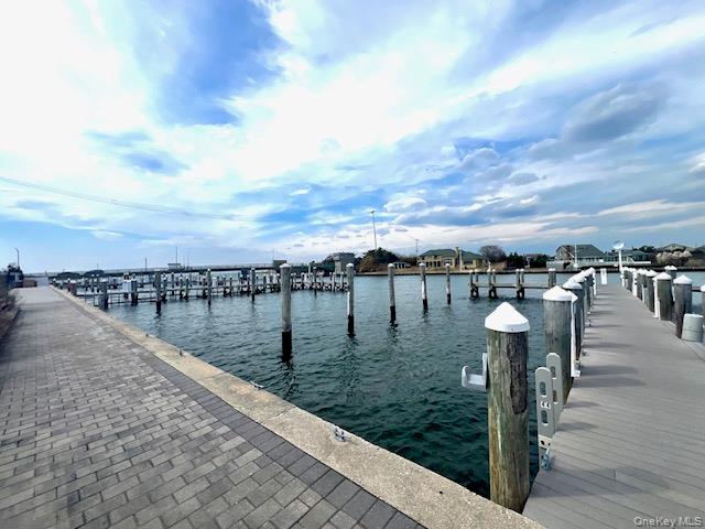231 Dune Road, Unit 905 Westhampton Beach, NY 11978 - Photo 8 of 24 Opposite unit. Dock featuring a water view