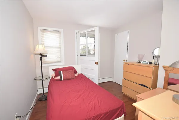 a bedroom with a bed and a table in it