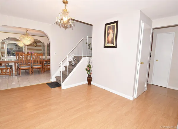 a view of a livingroom with furniture and stairs
