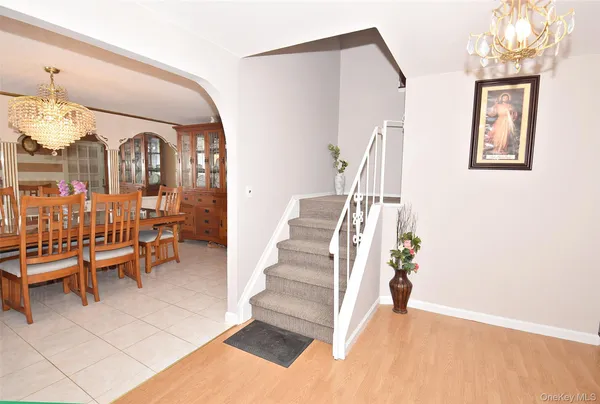 a view of a livingroom with furniture and staircase