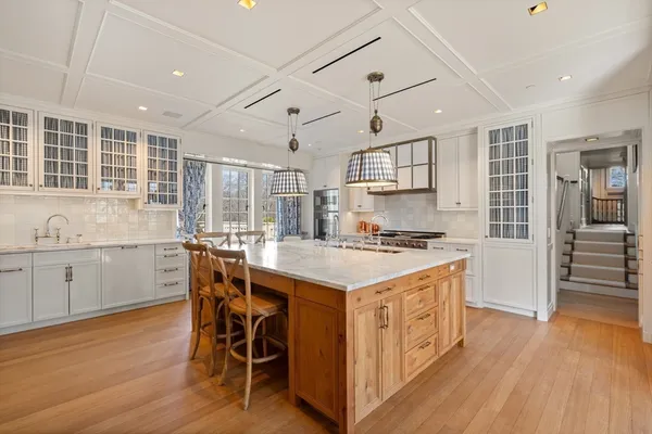 a kitchen with stainless steel appliances granite countertop a stove and a refrigerator