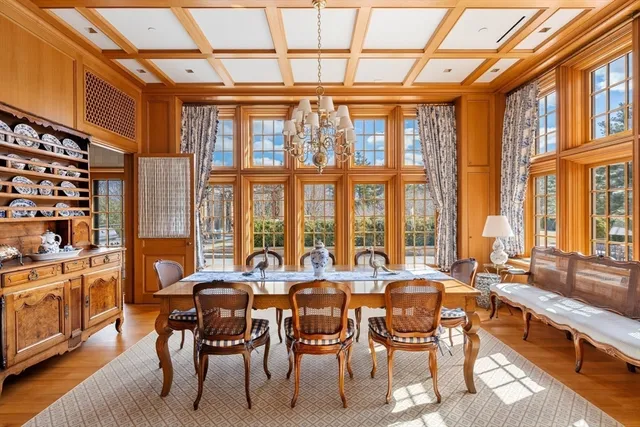 a view of a dining room with furniture and a window