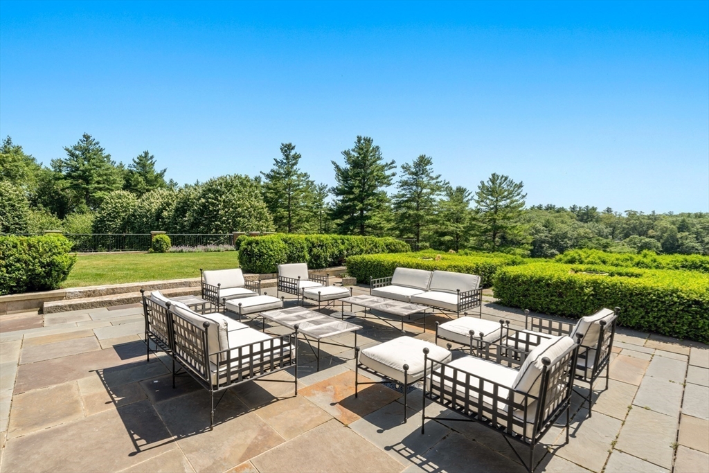 4 Willow Road Weston, MA 02493 - Photo 17 of 42 a view of backyard with seating area and green space