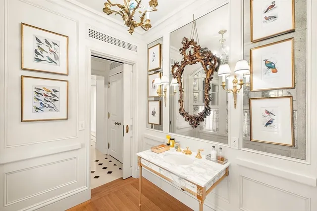 a bathroom with a tub sink and mirror