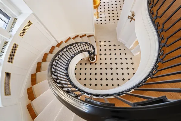 a view of staircase with wooden floor