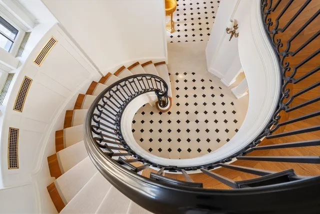 a view of staircase with wooden floor