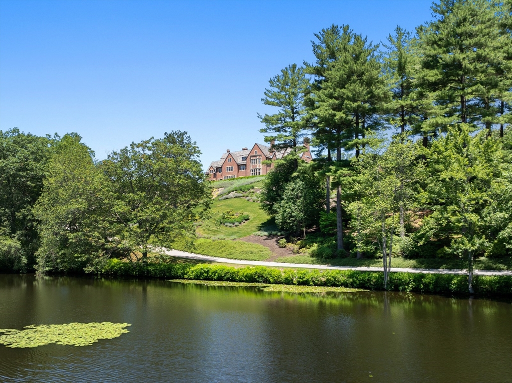 4 Willow Road Weston, MA 02493 - Photo 2 of 42 an aerial view of residential houses with outdoor space and lake view