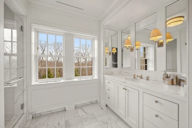 a living room with furniture and a mirror
