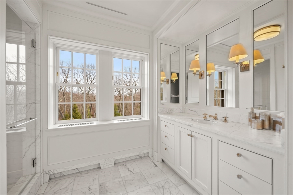 4 Willow Road Weston, MA 02493 - Photo 27 of 42 a bathroom with a granite countertop sink and a mirror