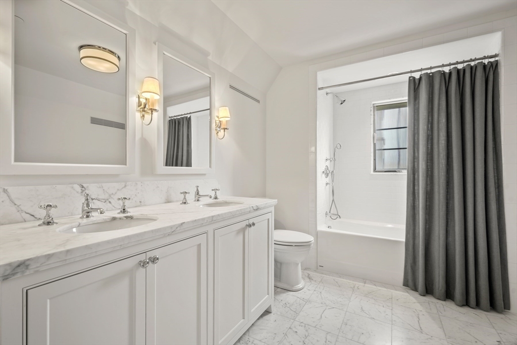 4 Willow Road Weston, MA 02493 - Photo 31 of 42 a bathroom with a granite countertop sink toilet and shower