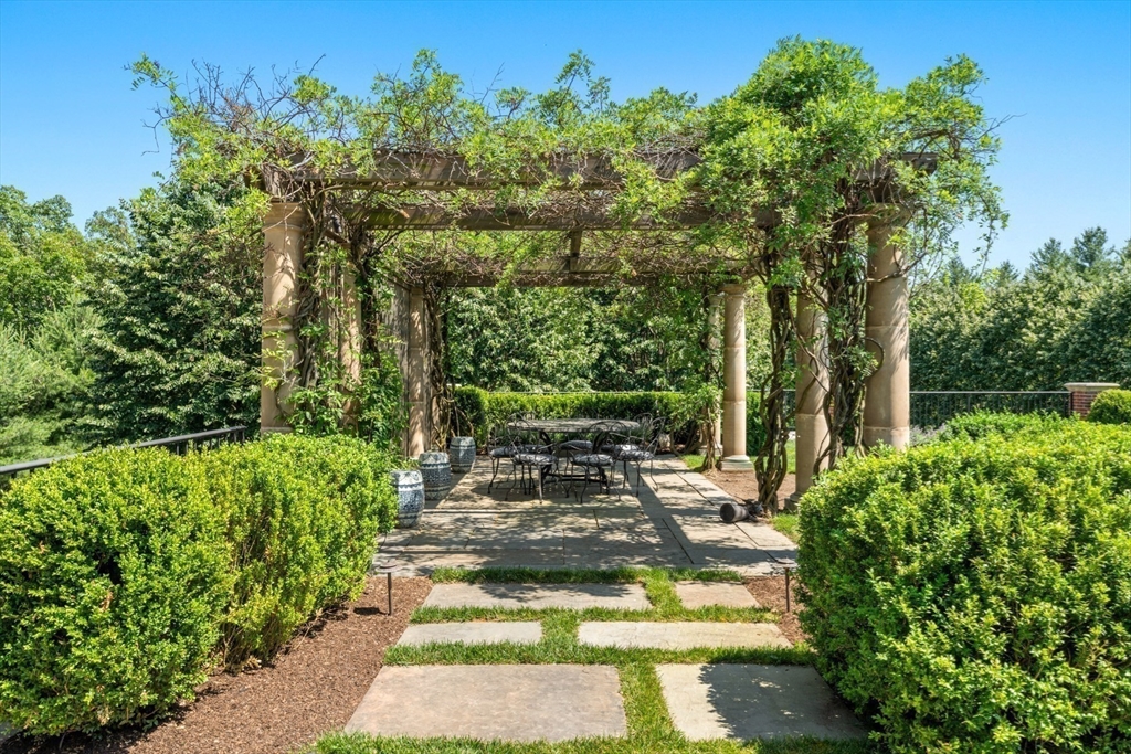 4 Willow Road Weston, MA 02493 - Photo 35 of 42 a view of a yard with plants