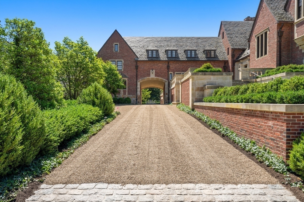 4 Willow Road Weston, MA 02493 - Photo 37 of 42 a front view of a house with garden