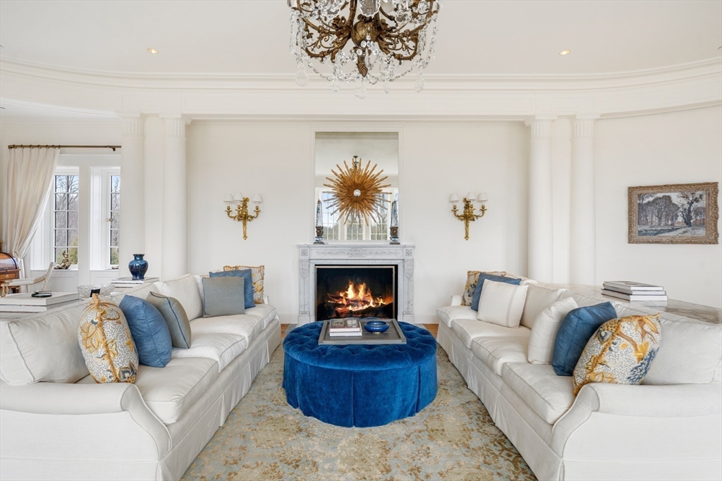 4 Willow Road Weston, MA 02493 - Photo 8 of 42 a living room with furniture and a fireplace