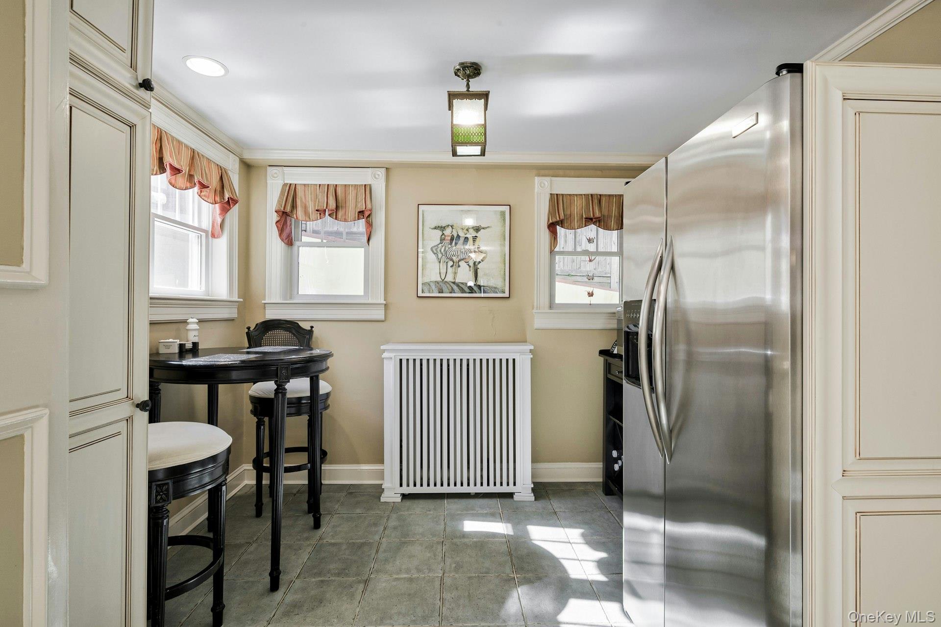126 Cove Road Oyster Bay, NY 11771 - Photo 20 of 46 a kitchen with stainless steel appliances granite countertop a refrigerator and a stove top oven