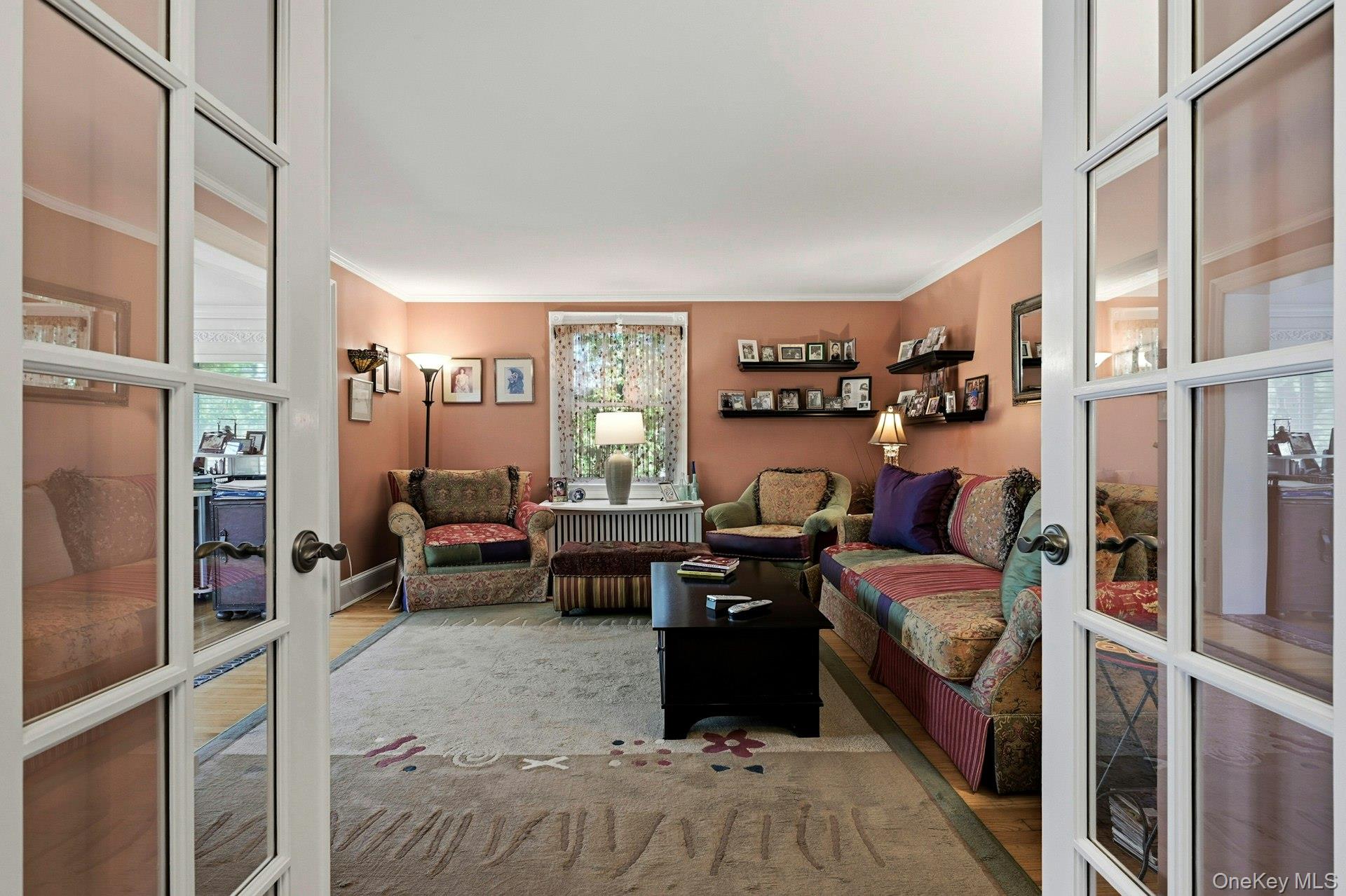 126 Cove Road Oyster Bay, NY 11771 - Photo 23 of 42 Living area with crown molding, wood finished floors, and french doors