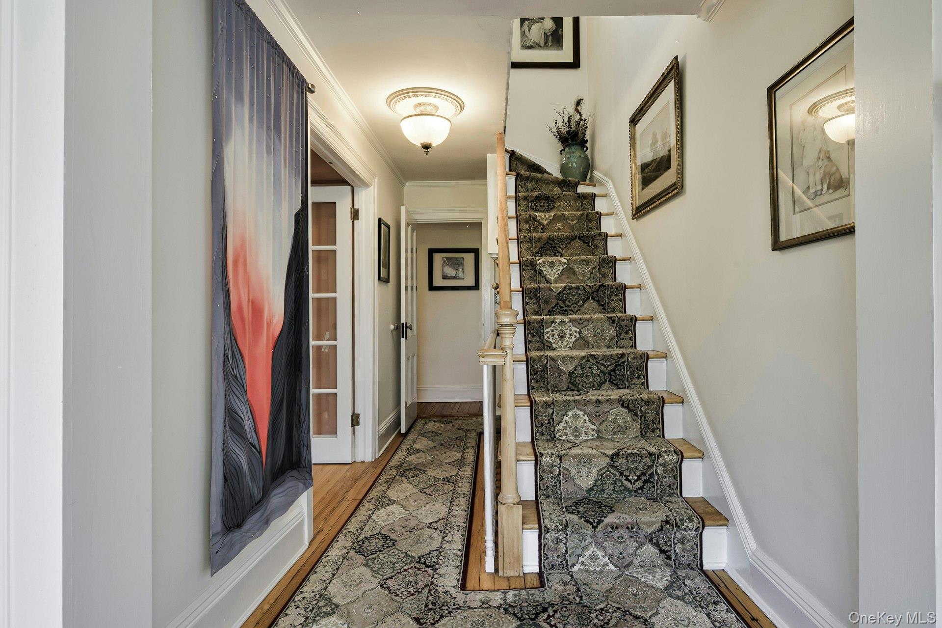 126 Cove Road Oyster Bay, NY 11771 - Photo 35 of 46 a view of a hallway with wooden floor and entryway