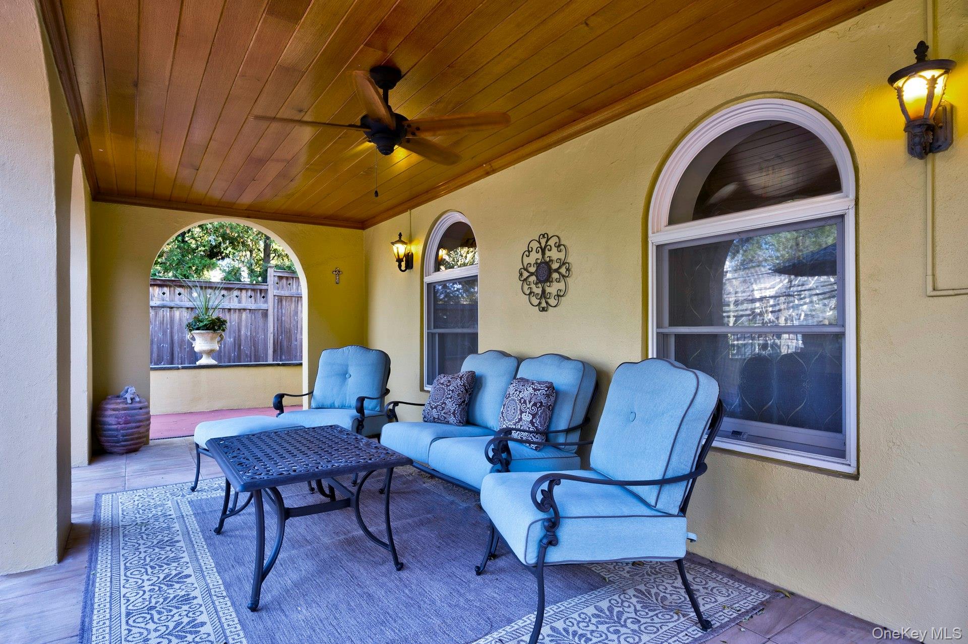 126 Cove Road Oyster Bay, NY 11771 - Photo 4 of 42 View of patio with a ceiling fan and an outdoor hangout area