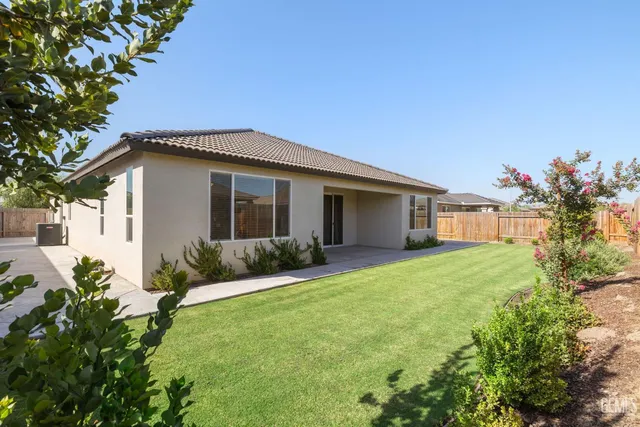 an aerial view of a house with a ocean view