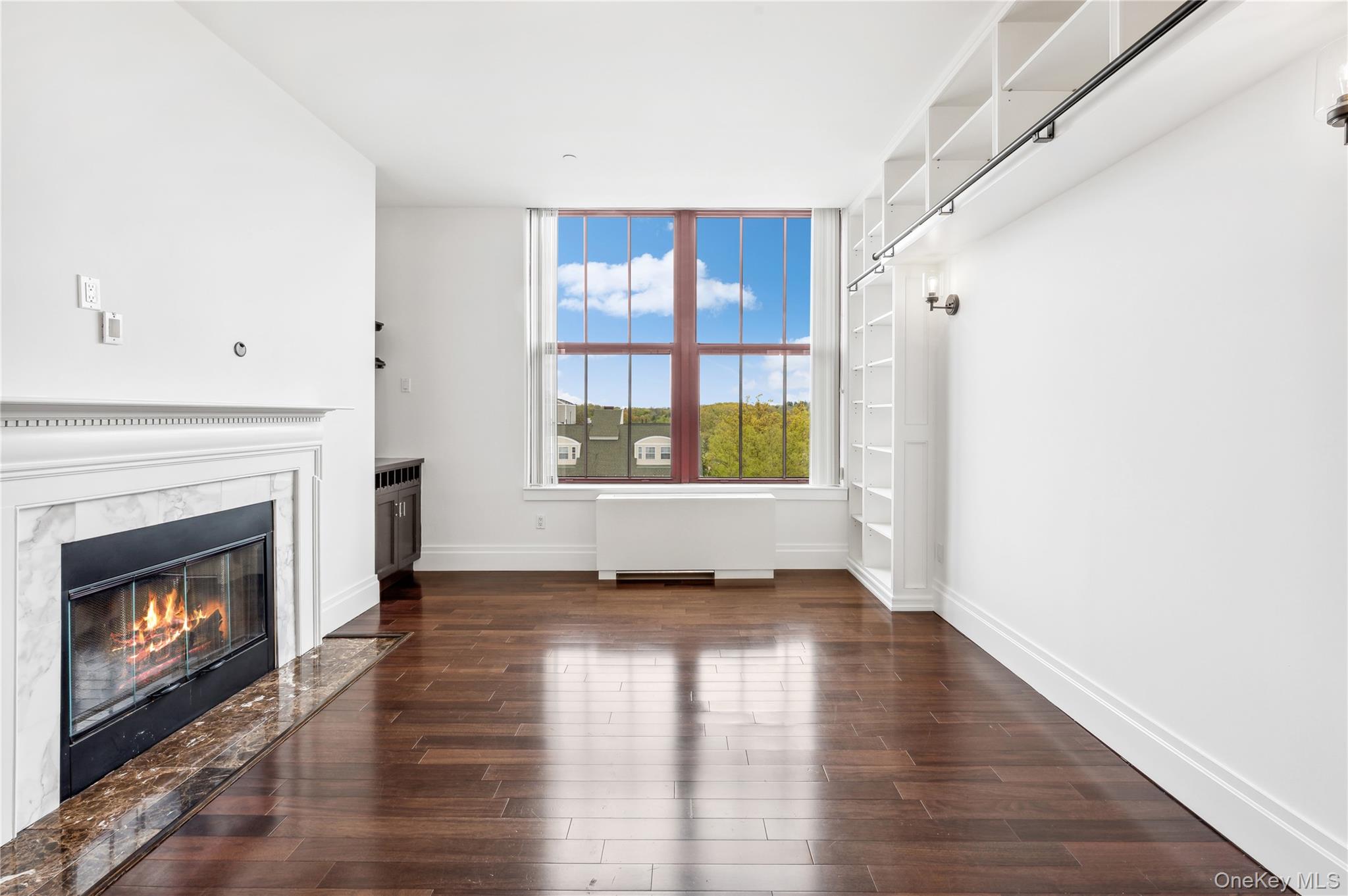 1 Scarsdale Road, Unit 613 Tuckahoe, NY 10707 - Photo 4 of 34 Living room with gas fireplace.