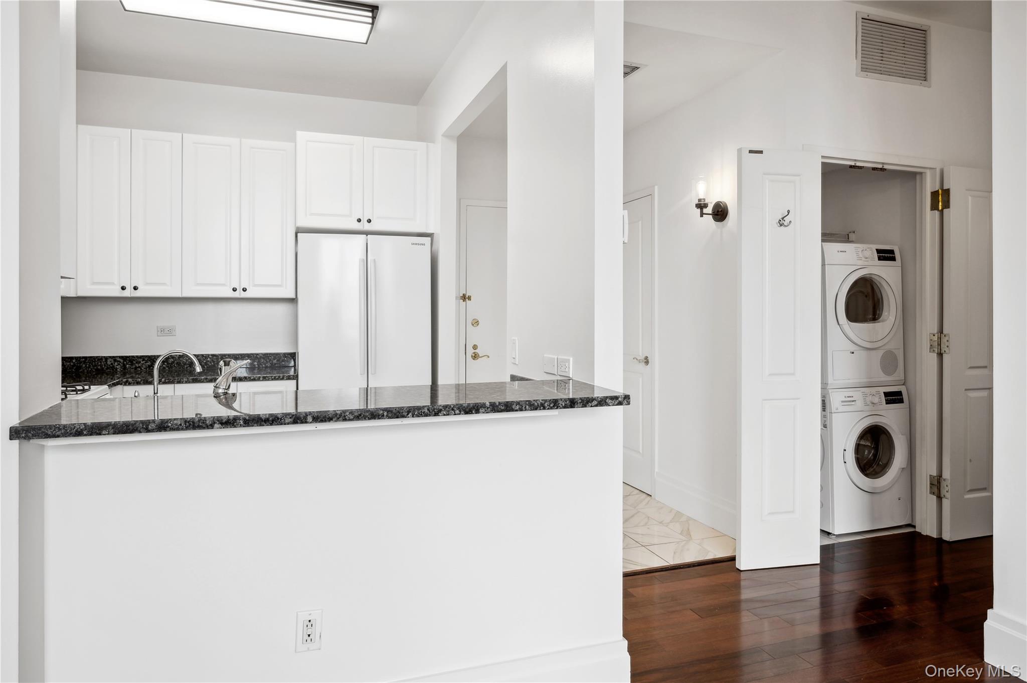 1 Scarsdale Road, Unit 613 Tuckahoe, NY 10707 - Photo 10 of 34 Bosch stackable washer and dryer off kitchen.