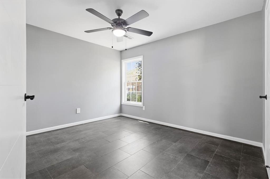 409 Calhoun Avenue Northeast Rome, GA 30161 - Photo 18 of 25 an empty room with a window and a fan