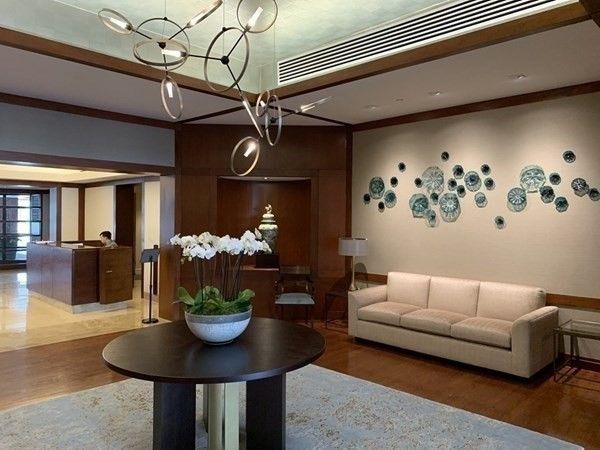 a living room with furniture and a dining table