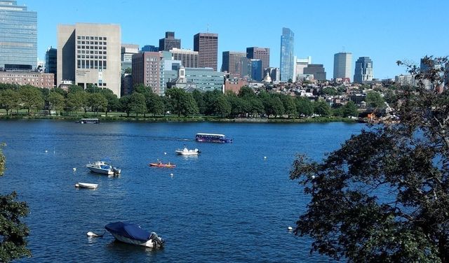 an aerial view of a city with a lake view