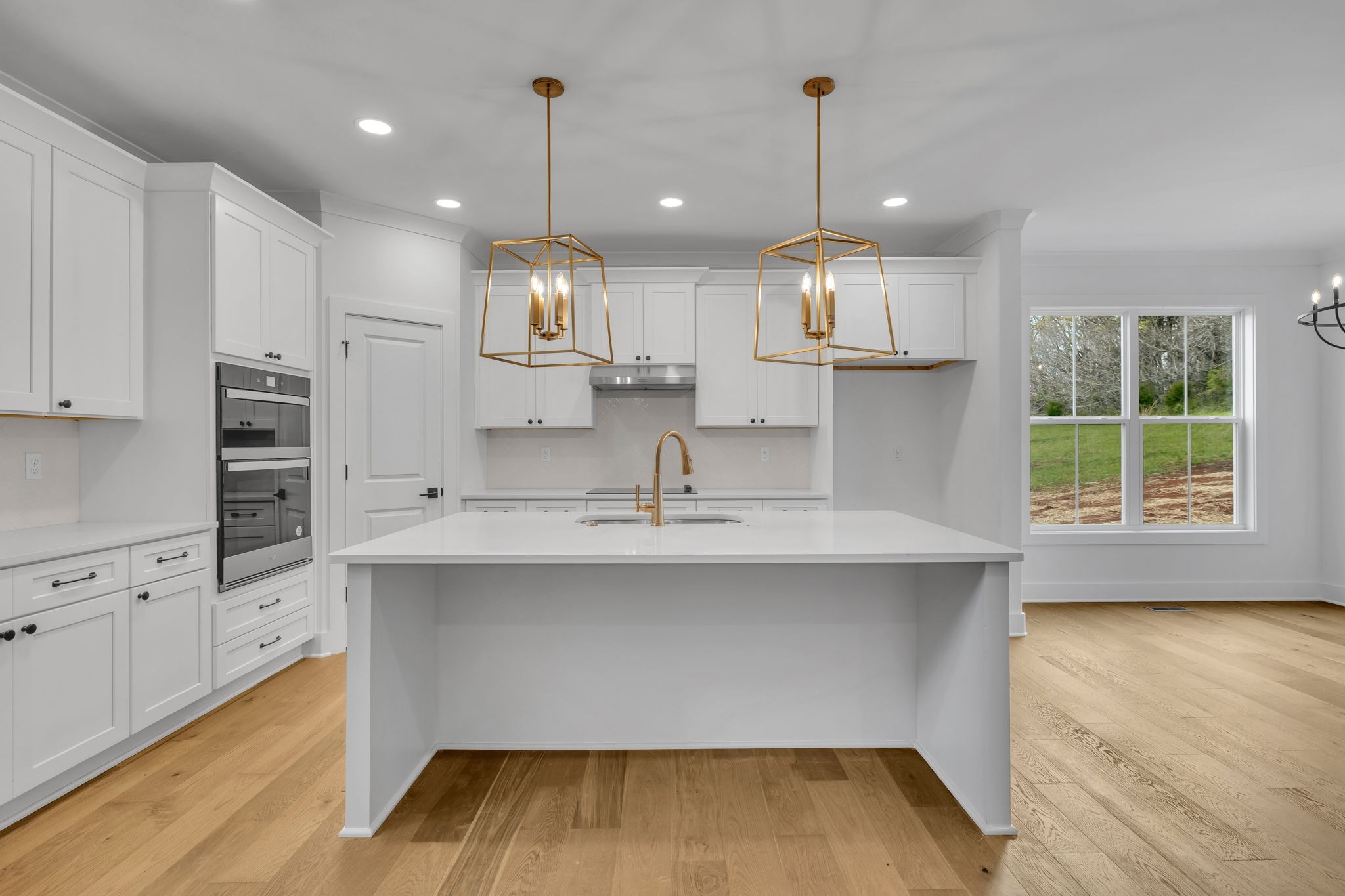 303 Noah Road Manchester, TN 37355 - Photo 17 of 63 a kitchen with kitchen island a sink stainless steel appliances and cabinets