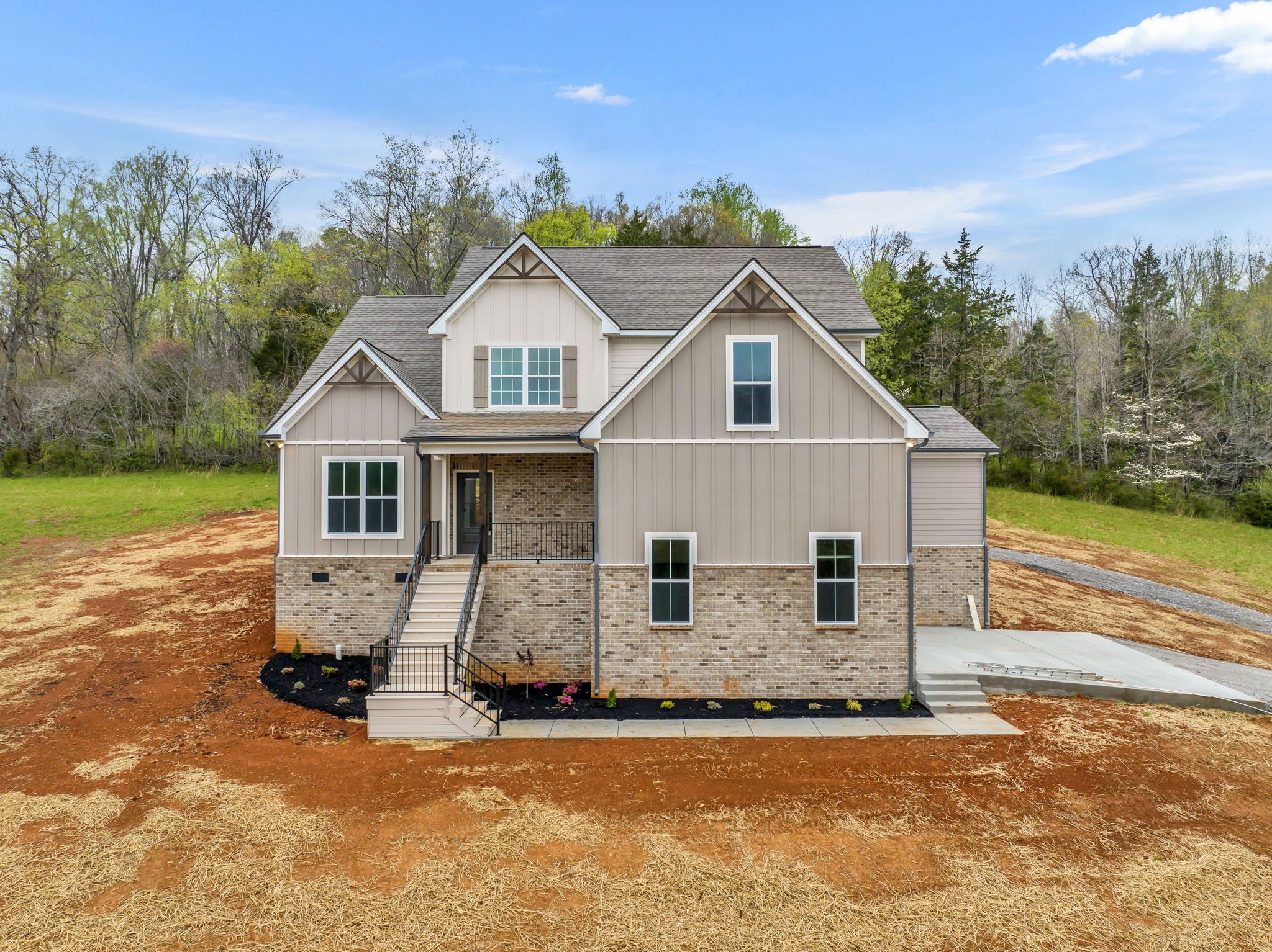 303 Noah Road Manchester, TN 37355 - Photo 3 of 63 a front view of a house with a yard and garage