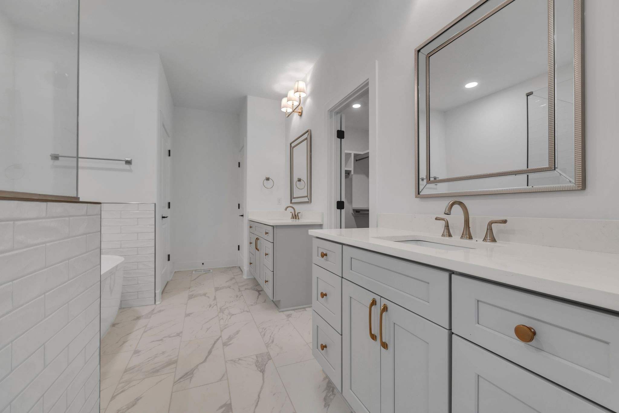 303 Noah Road Manchester, TN 37355 - Photo 33 of 63 a spacious bathroom with a shower sink and mirror