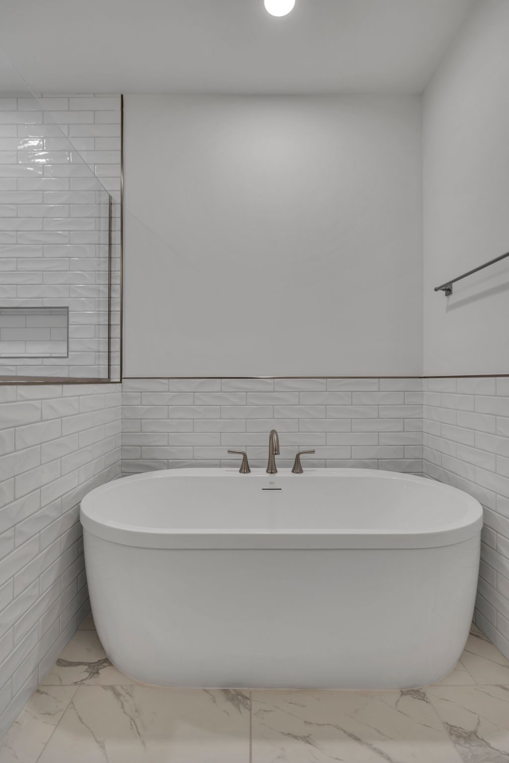 303 Noah Road Manchester, TN 37355 - Photo 34 of 63 a white bath tub sitting in a bathroom